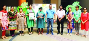 Dignitaries posing for a group photograph while displaying the certificate of International School Award won by KC International School, Jammu.