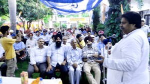 Senior Cong leader Raman Bhalla addressing party  meeting at Preet Nagar in Jammu on Monday.