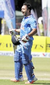 Indian batsman Kedar Jadhav celebrates after scoring an undefeated 105 during their third ODI against Zimbabwe in Harare on Tuesday. (UNI)