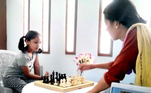 Players making moves in a match during a chess tournament at Udhampur on Friday.