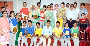 Winners of quiz competition posing for group photograph with Minister of State for Education Priya Sethi and others at MIER, BC Road in Jammu. 