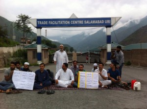 Uri residents holding protest outside TFC Salamabad on Tuesday.            	            —Excelsior/Aabid Nabi