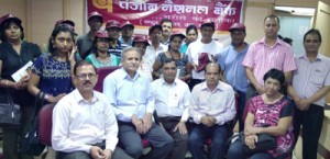 Amarnath bound NRIs at PNB counter at Jammu on Tuesday.