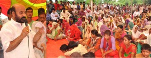 Minister for Social Welfare, Bali Bhagat addressing public gathering in Raipur-Domana Constituency on Sunday.