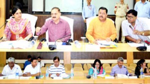 Divisional Commissioner Dr Pawan Kotwal chairing Shiv Khori Shrine Board meeting at Reasi on Thursday.