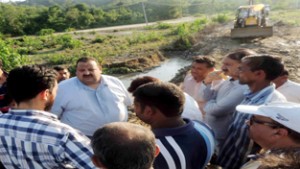 Provincial president National Conference Devender Singh Rana interacting with people during visit to rain hit areas of Nagrota.