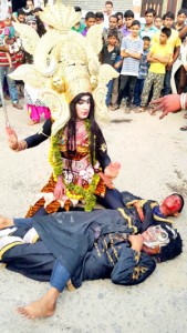 Artists playing mythical religious characters during Shoba Yatra of Pingla Mata at Udhampur on Wednesday.