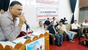 Official of J&K Grameen Bank addressing gathering during awareness programme on Monday.