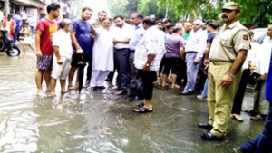 Sat Sharma, MLA West during his visit to rain affected areas on Tuesday.