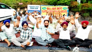 VRS employees staging protest outside Press Club, Jammu on Monday.        -Excelsior/Rakesh