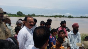 Former Minister, Surjeet Singh Slathia, taking stock of crop damages caused by incessant rains in Vijaypur area of Samba district.