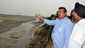 Minister for Industries & Commerce Chander Parkash Ganga during his visit to flood affected areas on Friday.