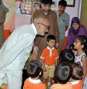 Education Minister, Naeem Akhtar interacting with kids during his visit to a school on Saturday.