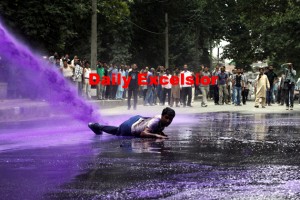 August- 10,2015  SRINAGAR : Daily-wage employees of Public Health Engineering (PHE) department shout anti-government slogans  march towards J&K Chief Ministers Residence Mufti Mohammad Sayed  as Police sprays purple-colored water from water cannon to disperse them during a protest in Srinagar on Monday.  Police detained dozens of employees and used water cannons to disperse the protesters when they were demanding regularization of their jobs and release of their pending salaries. The employees had planned to cordon the &K Chief Ministers Residence,  Mufti Mohammad Sayed . Photo/Mohd Amin War