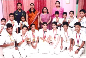 Skaters of DPS Jammu posing alongwith School Principal during felicitation function on Tuesday.