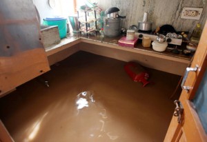 A kitchen flooded with water in Shastri Nagar area of Jammu on Thursday.  	                —Excelsior/Rakesh