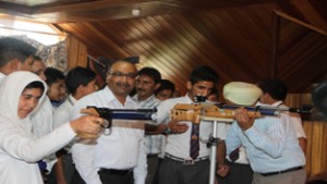 ADGP Dilbag Singh, President J&K Rifle Association amidst participating shooters aiming target while inaugurating Rifle Championship at Shooting Range Khalsa High School, Magarmal Bagh in Srinagar.