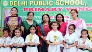 Winners of Hindi Recitation posing for a photograph at DPS Jammu. 