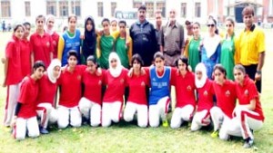 Women footballers posing for a group photograph during opening ceremony of Annual Women’s Football Knockout Tournament in Srinagar.