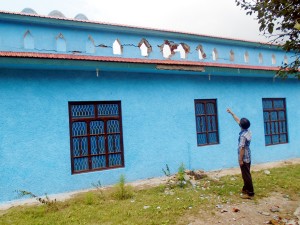 A civilian shows damage caused to his house during Pakistan shelling in Balakote on Wednesday.