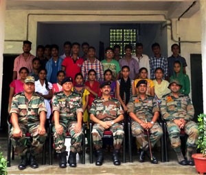 Students posing alongwith Army Personnel during Computer Awareness Programme organized by Sabre Brigade on Friday.