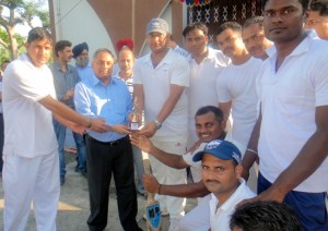 Winners being presented trophy by the chief guest.