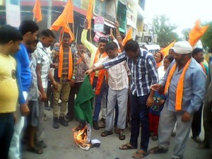 Activists of Shiv Sena (Bala Sahib Thackeray) burning Pakistan flag during a protest at Jammu on Sunday.