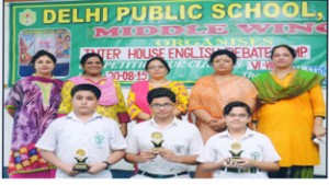 Winners of Inter House Debate Competition posing for a group photograph at DPS in Jammu.