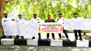 ABVP activists displaying banner and signature sheets during campaign at JU on Monday.