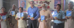 Station Director Radio Kashmir Jammu V.K Sambyal, SSP Shailendra Singh and other dignitaries releasing the book ‘Hirakhae Di Peed’ by Tara Danpuri at Jammu on Saturday.