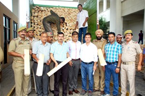 Deputy Excise Commissioner Rajesh Sharma and others with seized willow clefts.