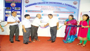 Dignitaries interacting with each other during orientation programme at Yogananda College of Engineering and Technology in Jammu.