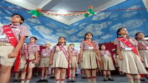 Students of Jodhamal Public School presenting patriotic song during Investiture Ceremony on Friday.