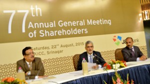 Commissioner/ Secretary Finance, Navin Choudhary (L) and Chairman/ CEO  of  JK Bank Mushtaq Ahmed (C) at 77th AGM of  the Bank in Srinagar on Saturday.