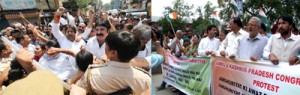 Congress activists protesting in Jammu (L) and PCC chief GA Mir leading protest in Srinagar (R).