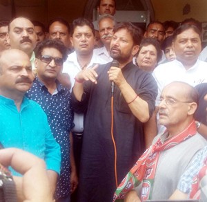 Minister for Health, Ch Lal Singh addressing BJP activists at Pt. Prem Nath Dogra Bhawan on Saturday. 