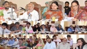 Minister for Education, Naeem Akhtar chairing a meeting at Srinagar on Friday.