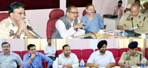 Deputy Chief Minister Dr Nirmal Singh chairing a meeting at Jammu on Monday. 