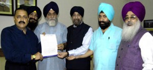 Union Minister Dr Jitendra Singh receiving a memorandum from the representatives of 1984 riot victims at New Delhi on Tuesday.