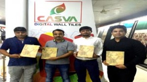 Officials of Casva Tiles Private Limited showing products during dealers’ meet at Jammu on Saturday.