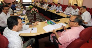 Deputy Chief Minister, Dr Nirmal Singh addressing officers during a meeting at Jammu on Tuesday.