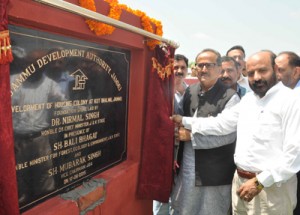 DyCM Dr Nirmal Singh and Minister for Forest Bali Bhagat laying foundation stone of housing colony at Kot Bhalwal on Monday.