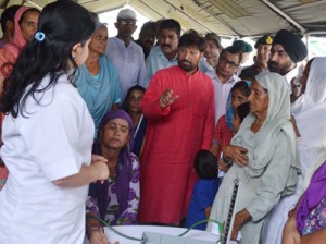 Minister for Health Ch Lal Singh interacting with a doctor at Medical Camp on Tuesday.