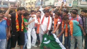 Activists of Shiv Sena (Bala Sahib Thackeray) burning Pakistan flag during a protest at Bari-Brahmana in Samba district. 