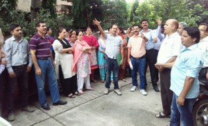 Narinder Sharma, Secretary LIC Class-1 Federation leading the demonstrators outside LIC Office DO Cell Jammu on Wednesday.