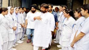 Health Minister Ch Lal Singh during visit to AMT School on Friday.