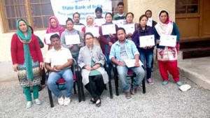 Participants of PMEGP programme posing with certificates at SBI-RSETI, Leh on Tuesday.