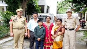 GRP Jammu handing over detached girl to her parents.