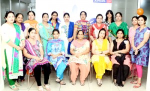 Members of Aircel Women Welfare Association posing for a group photograph on Tuesday.