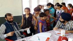 HoD Cardiology Dr Sushil Sharma examining children on Sunday.